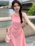 Exquisite pink halter-neck slip dress, exuding a pure, sexy charm with a fitted waist and flowing skirt.
