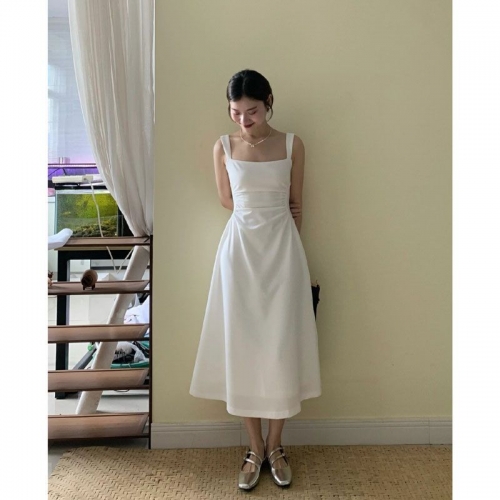 French-style elegant white slip dress with a slim waist and square neckline, perfect for a gentle and feminine look.