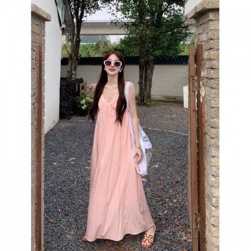 Pink sundress with French V-neck, loose fit, slimming, sleeveless, beach dress for summer, perfect for a beach vacation.