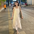 White vest dress for women, summer 2025 new style, French loose design, mid-length, irregular straps.