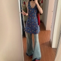 French-style blue sleeveless floral print vest dress for women, new summer 2025 style, beach vacation vibe.