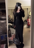 A subtly sexy and figure-flattering black maxi dress with cutouts perfect for autumn and winter; a sophisticated and slimming inner layer dress.