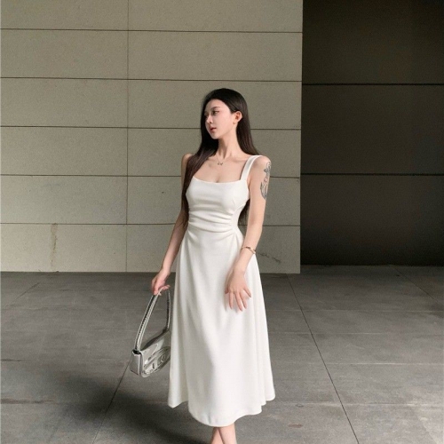 French chic and sophisticated, petite white slip dress with a cinched waist, perfect for spring and summer. French chic and sophisticated, petite white slip dress with a cinched waist, perfect for spring and summer.