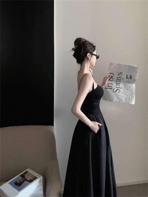 French-style sophisticated black slip dress for women, trending this summer of 2024, sexy, fitted, sleeveless.