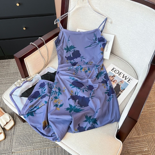 Real shot of a sexy, form-fitting, bodycon halter dress with French chic and unique design - a purple summer dress for women.