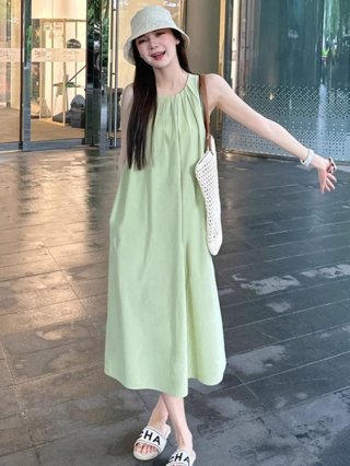 Green sleeveless vest dress for women, new summer 2025 style, perfect for beach vacations, French chic and sophisticated.