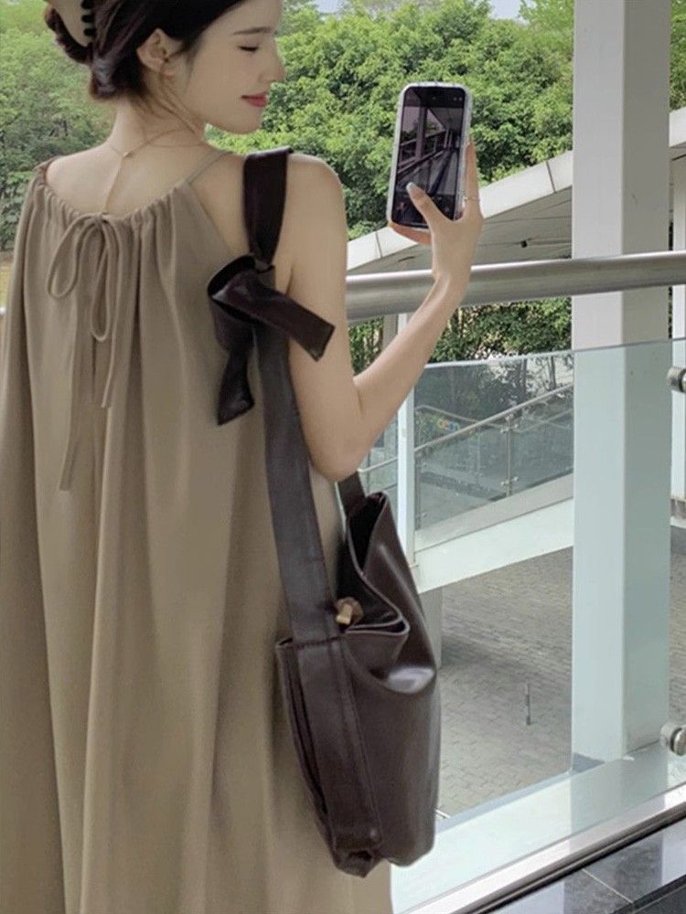 Halter neck suspender dress, new summer 2024 style, pear-shaped figure, loose and slimming, elegant French style.