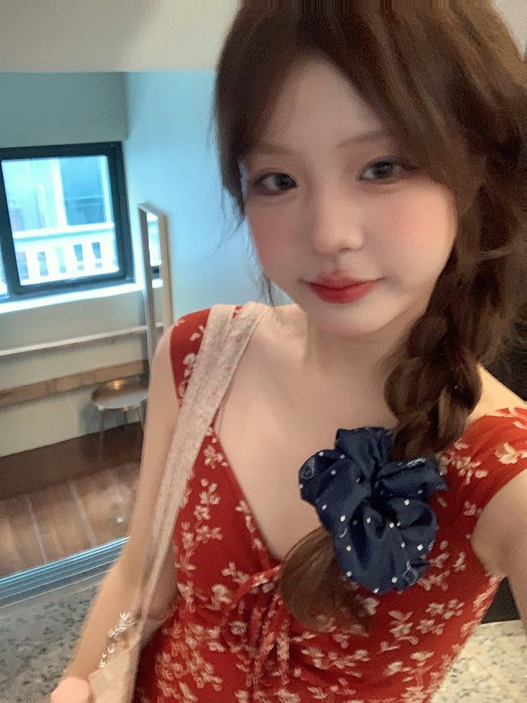 French-style red floral print sundress for women, perfect for summer 2025, ideal for beach vacations.