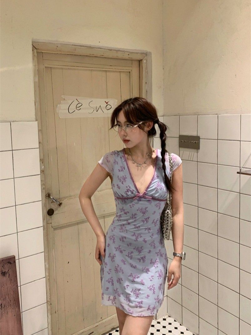 Pure and alluring style, Instagram-worthy short dress for women, summery feel, small flutter sleeves, V-neck, fitted waist, A-line silhouette, floral print with bow.