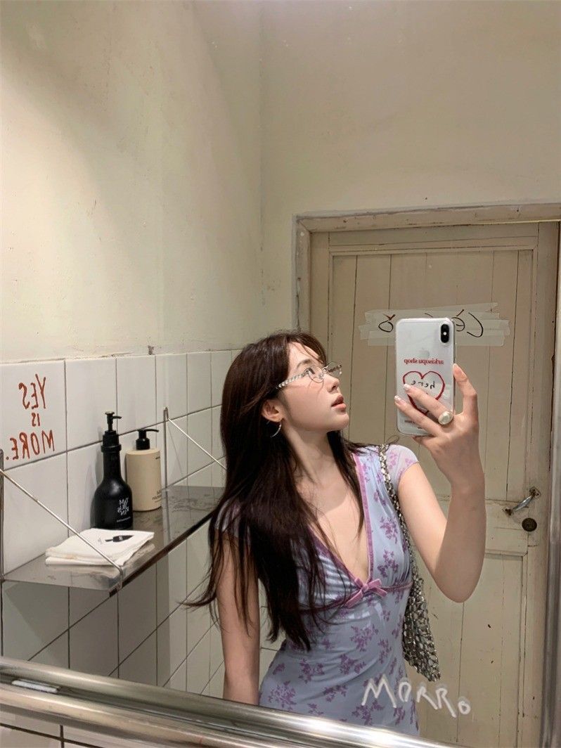 Pure and alluring style, Instagram-worthy short dress for women, summery feel, small flutter sleeves, V-neck, fitted waist, A-line silhouette, floral print with bow.