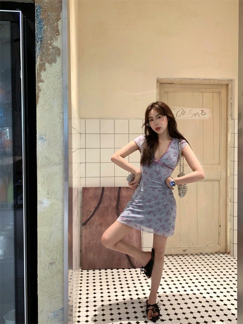 Pure and alluring style, Instagram-worthy short dress for women, summery feel, small flutter sleeves, V-neck, fitted waist, A-line silhouette, floral print with bow.