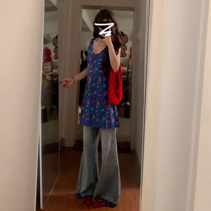 French-style blue sleeveless floral print vest dress for women, new summer 2025 style, beach vacation vibe.