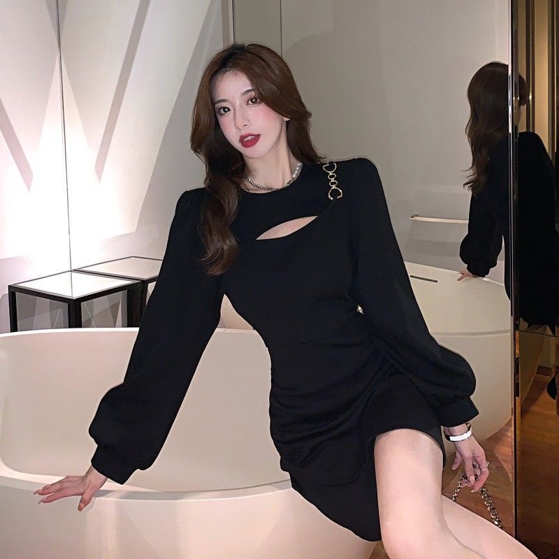 A stunning, unique, and sophisticated autumn dress with a flattering, cinched waist that's perfect for petite figures and has a sexy, subtly sexy cutout design.