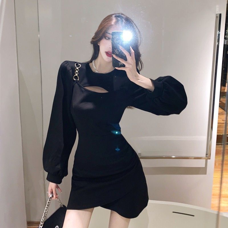 A stunning, unique, and sophisticated autumn dress with a flattering, cinched waist that's perfect for petite figures and has a sexy, subtly sexy cutout design.