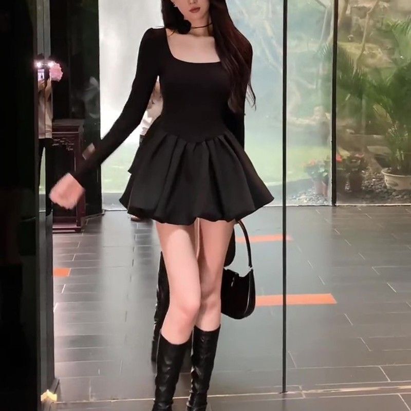 Petite, stylish, fitted little black dress with long sleeves, A-line tulip skirt, and puffy princess dress.