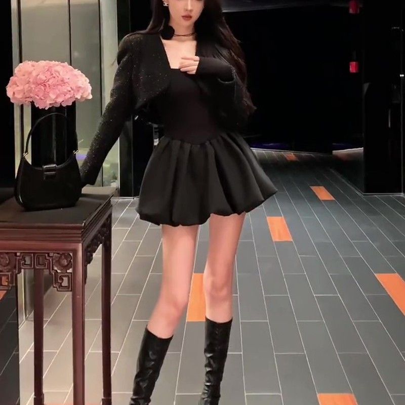 Petite, stylish, fitted little black dress with long sleeves, A-line tulip skirt, and puffy princess dress.