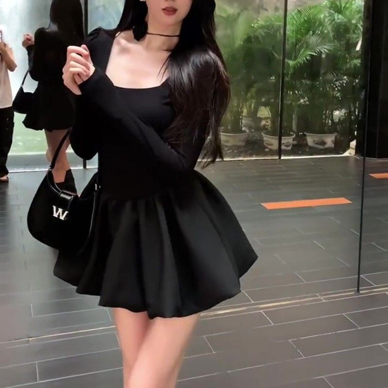 Petite, stylish, fitted little black dress with long sleeves, A-line tulip skirt, and puffy princess dress.