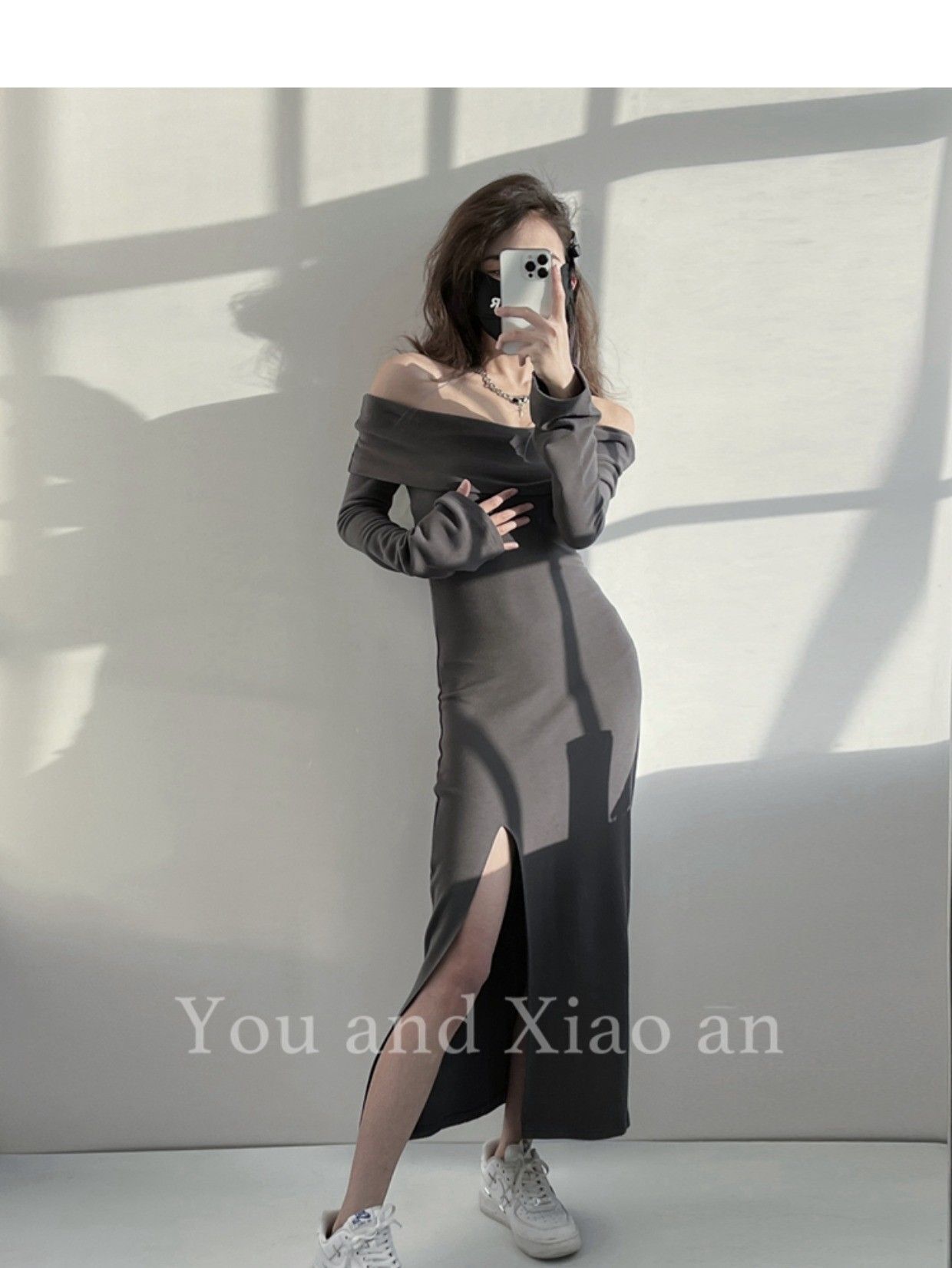 A sexy off-the-shoulder strapless dress for women, exuding a sophisticated and mature vibe with a cinched waist and slit.