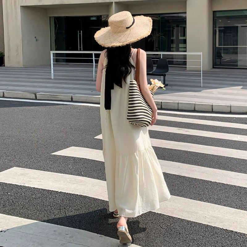 Off-white spaghetti strap dress for women, 2025 summer new style, French high-end feel, elegant and fairy-like, perfect for beach vacations.