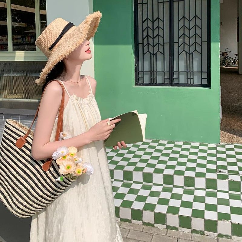 Off-white spaghetti strap dress for women, 2025 summer new style, French high-end feel, elegant and fairy-like, perfect for beach vacations.