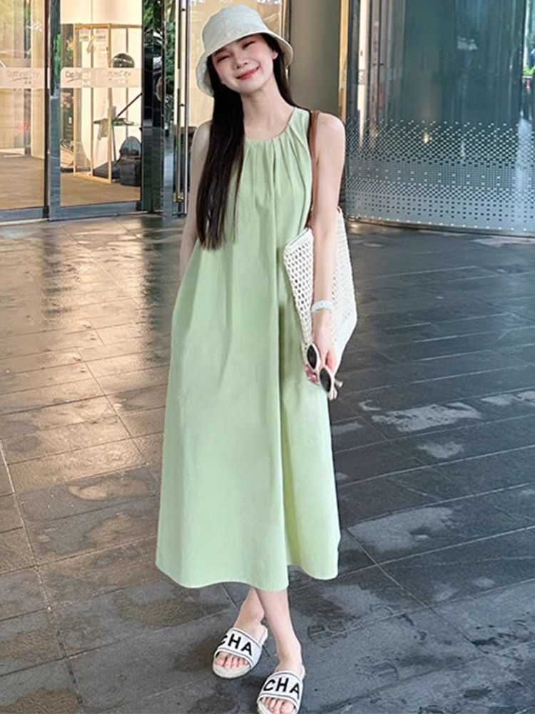 Green sleeveless vest dress for women, new summer 2025 style, perfect for beach vacations, French chic and sophisticated.