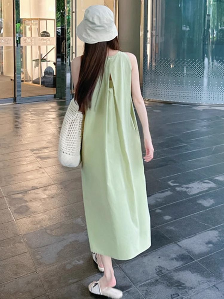 Green sleeveless vest dress for women, new summer 2025 style, perfect for beach vacations, French chic and sophisticated.