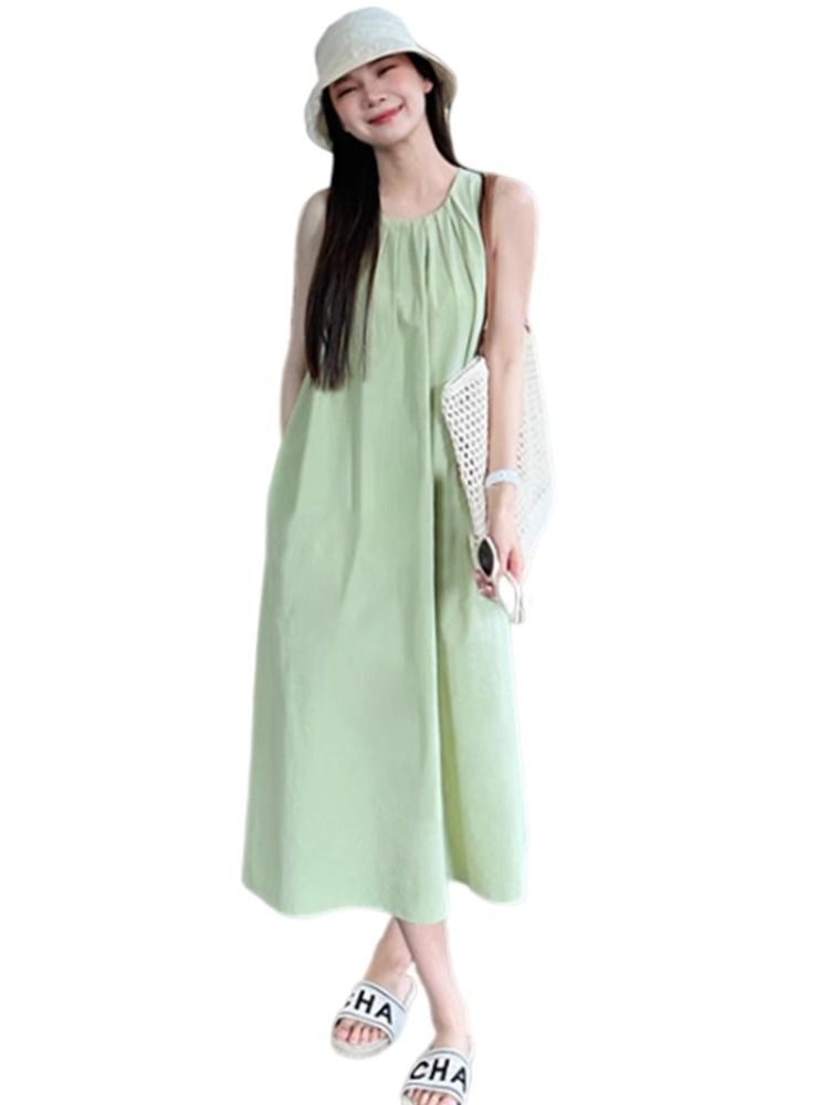 Green sleeveless vest dress for women, new summer 2025 style, perfect for beach vacations, French chic and sophisticated.